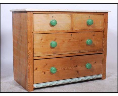 A vintage early 20th Century country pine chest of drawers, two short drawers over two long, painted top with applied painted