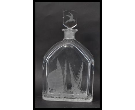 A vintage 20th century Orrefors decanter designed by Edward Hald (1921) engraved by Zaglo showing yacht scenes on body and on