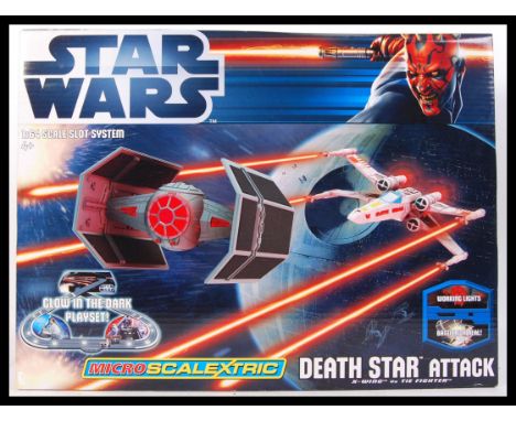 An original 1/64 scale Star Wars ' Death Star Attack ' micro scalextric slot car racing set. Appears sealed, within the origi