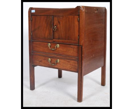 An early 19th century Georgian mahogany bedside being gallery tray top with twin door cupboard above pull out ceramic commode