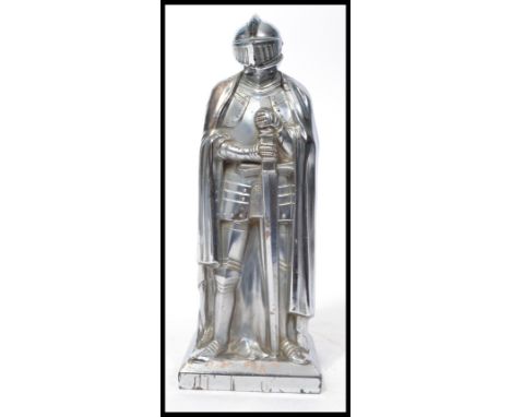 A vintage 20th century novelty table lighter of large proportion in the form of a knight having a hinged helmet lid containin