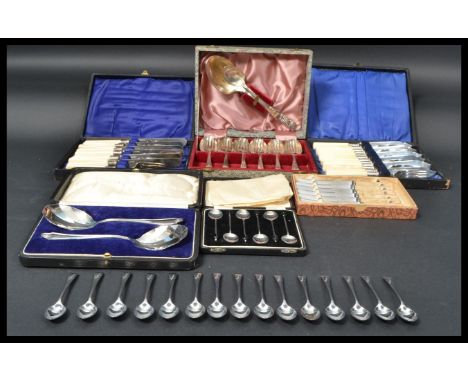 A collection of vintage 20th Century cased flatware to include a set of silver hallmarked coffee bean spoons, dessert cutlery