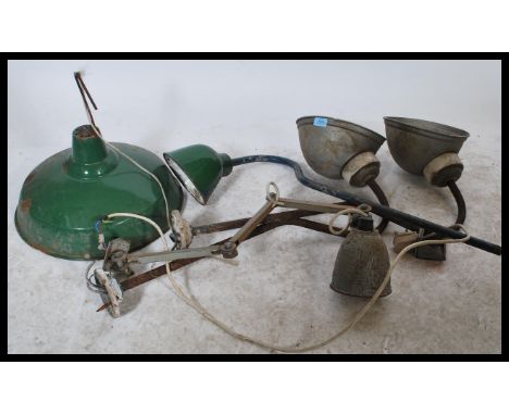 A collection of vintage 20th Century enamel industrial factory lights, to include wall and ceiling examples please refer to i