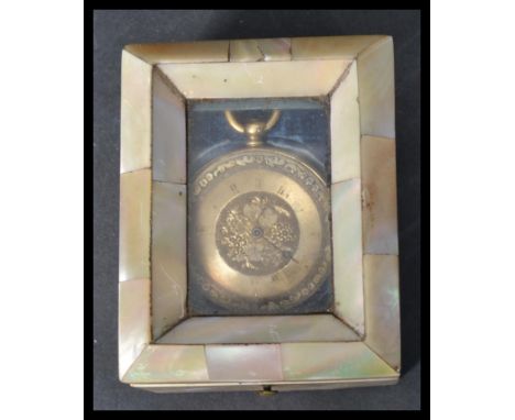 A vintage 18ct gold ladies fob watch with engine turned face and faceted hand ( af ) set with a mother of pearl pocket watch 