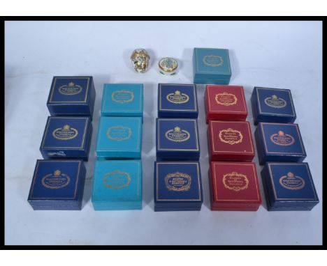 A large collection of 20th century Halycon Days and Bilston and Battersea enamel on copper pill pots, many retaining original