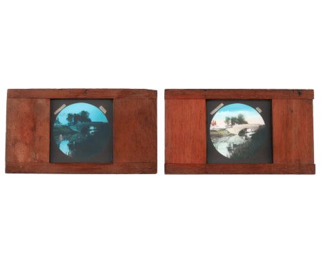 Magic Lantern Slides, pair of hand coloured magic lantern dissolving view slides, river scene and day and night, measuring 17