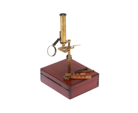 French, c.1850, unsigned, the microscope mounted on a brass boss to the top of the case, with rack and pinion focus to small 