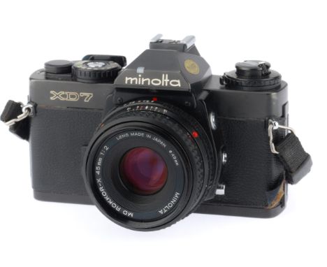 black, body G, leatherette lifting in one edge, shutter works, metering responds to light, viewfinder display works, with a R