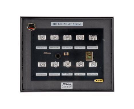 framed display, with 10 relief cameras from the Nikon I, 1948 to the Nikon F4, 1988, overall size 21cm x 25cm