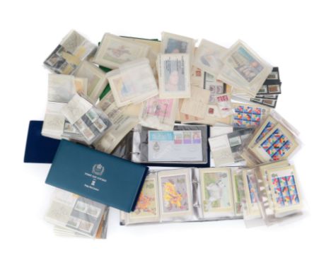 Including albums of first day covers in albums marked 'FIRST DAY COVERS from Pobjoy Mint Limited' a large number of postcards