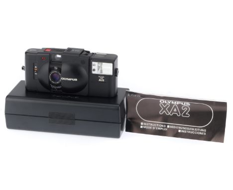black, body VG, one light mark on the back, shutter works, meterng responds to light, viewfinder LED works, with maker's pres