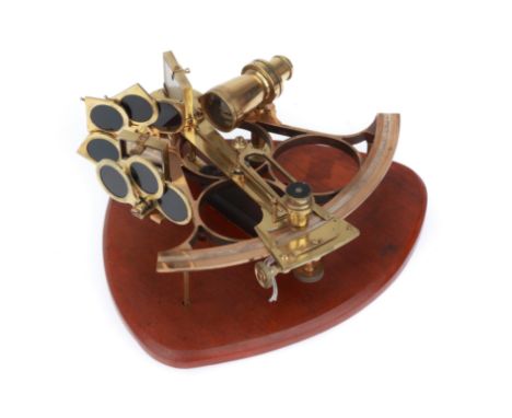 English, c.1950, unsigned, polished brass sextant on shaped wall mounting, sextant with single telescope, and filtered, base 