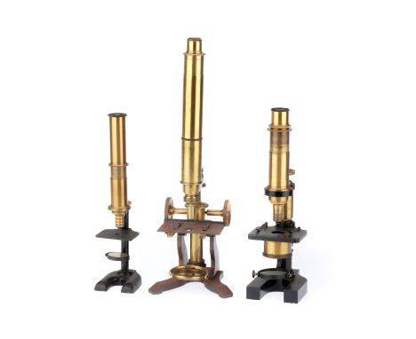 including a small brass French student microscope, another French microscope on a 'Y' shaped base engraved Hartnack &amp; Pra