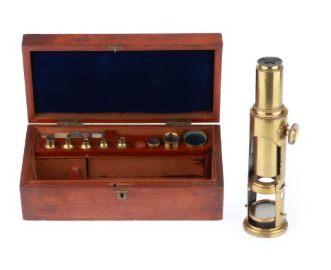 English, c.1850, unsigned, French polished wooden case opens to reveal lacquered brass microscope with objective lenses, live