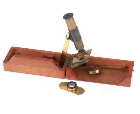 English, c.1880, engraved 'J. H. STEWARD, 406 STRAND', microscope folds up out of French polished mahogany case, adjustable m