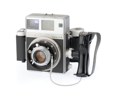 silver, serial number A19503, body F, rangefinder patch clear and moving, rear bellows appear G, with a Mamiya-Sekor f/3.5 10