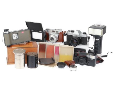 comprising a Yashica TL-Electro, silver, body F, shutter works, advance jammed, with a Yashinon f/1.9 50mm lens, a Kodak Reti