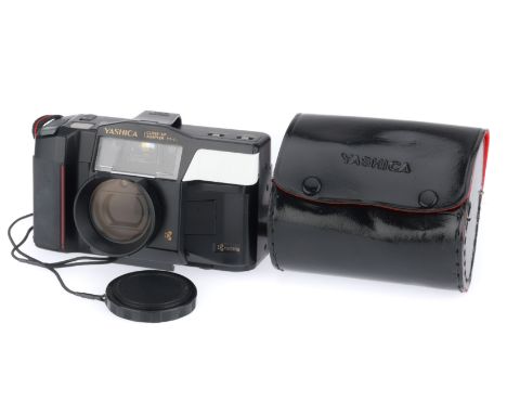 black, body G, powers up, flashes, takes a shot, has Carl Zeiss Tessar T* f/3.5 35mm lens, comes with the close-up attachment