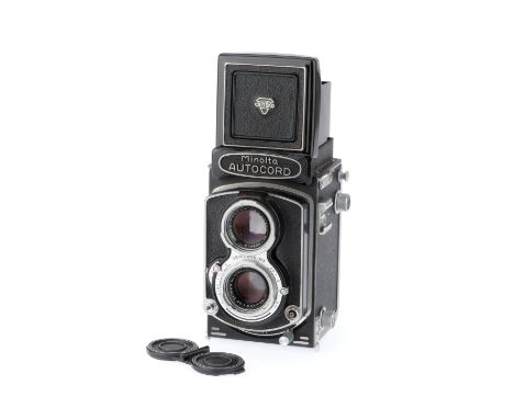 black, serial number 209740, body G, iris works, shutter works, with Rokkor f/3.5 75mm lens, optics G, with caps.