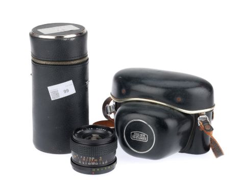 black, body G-VG, optics G-VG, some light haze present, with a Zeiss Ikon Voigtlander camera case, &amp; an unmarked lens cas