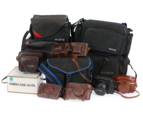 to include a Leitz compartment bag, a Nikon F-4 branded bag, several Minolta branded bags and a number of assorted leather ca