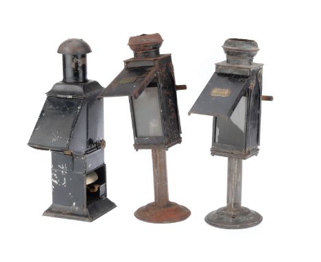 collection of 3 magic lantern operators lamps including an oil lamp version with bell, and 2 candle versions both stamped 'Th