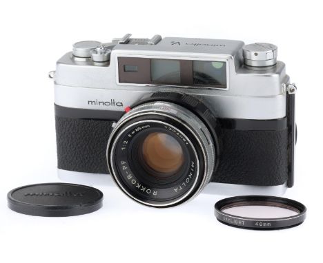 silver, serial number 124908, body VG, shutter works, rangefinder works, with a f/2 45mm Rokkor-PF Lens, with cap and case.
