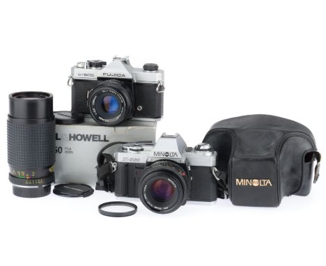 comprising a Fujica ST605, silver. body G, shutter works, with a Fujinon f/2.2 55mm lens, barrel G, optics G, and a Minolta X