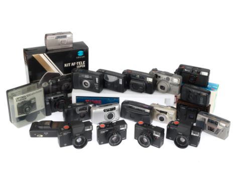 to include a Minolta AF-Tele, in maker's box, a Ricoh FF-9S, in maker's box, a Fuji DL200, in maker's box, Ricoh RZ728, Konic