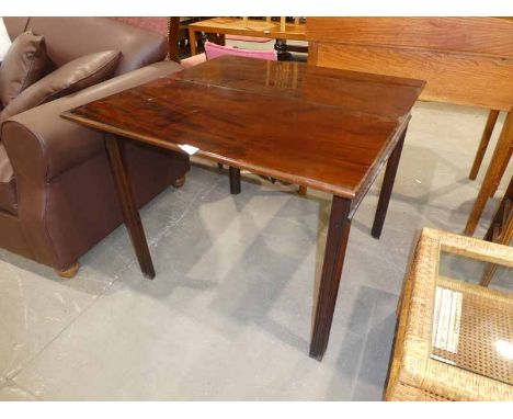 An early 19th century Georgian mahogany fold over Tea Table of rectangular form, hinged moulded edge top flame mahogany friez