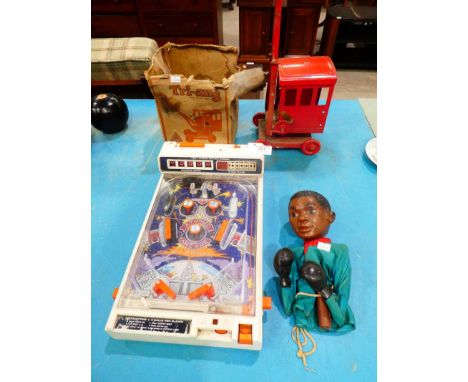 A Tomy atomic arcade pinball, triang tinplate crane and Cassius clay hand puppet