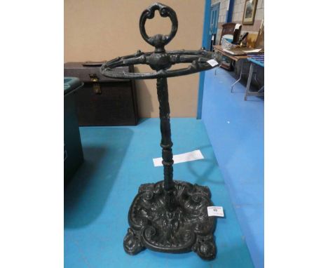 A short cast iron umbrella/walking stick stand 