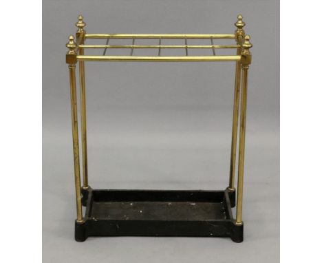 A reproduction Victorian style tubular brass frame twelve division rectangular stick stand, with cast iron drip tray base, 51