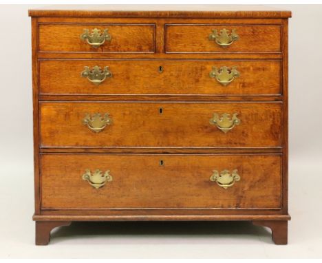 A George III oak chest, the rectangular top above two short and three long drawers, on later bracket feet, 94cm wide x 48cm d