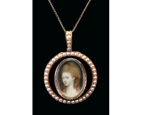 An 18th Century oval portrait miniature of a bust of a lady, in a yellow metal mount, later suspended from a seed pearl-set o