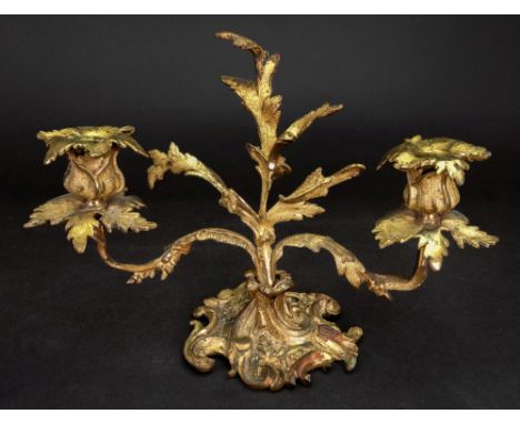 A Louis XV style gilt metal two light dwarf candelabrum, 19th century, cast with acanthus, 21cm high.