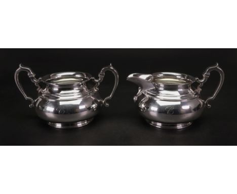 A mid 18th century style compressed baluster shape silver sugar basin and milk jug, Bristol Goldsmiths Alliance, London 1933 