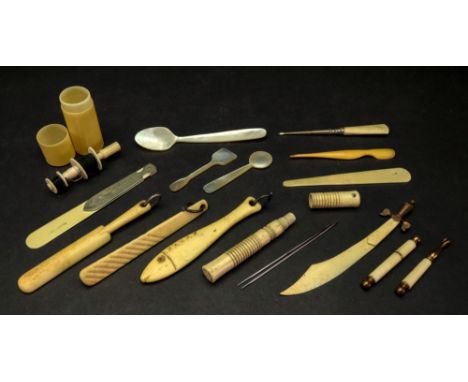A ring turned cylindrical bone needle case, 19th century, with screw-off cap, 9cm high, a gilt metal mounted bone novelty boo