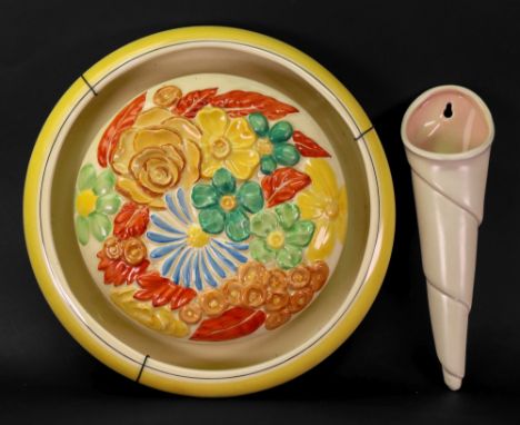 A Clarice Cliff Bizarre shape '729' flower holder centrepiece 29cm diameter and a Clarice Cliff wall bracket, 24cm long (2).