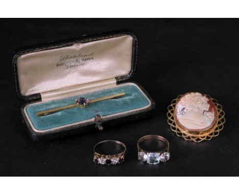 A small collection of jewellery comprising a late 19th/early 20th century 15ct gold stick pin set with a circular-cut amethys