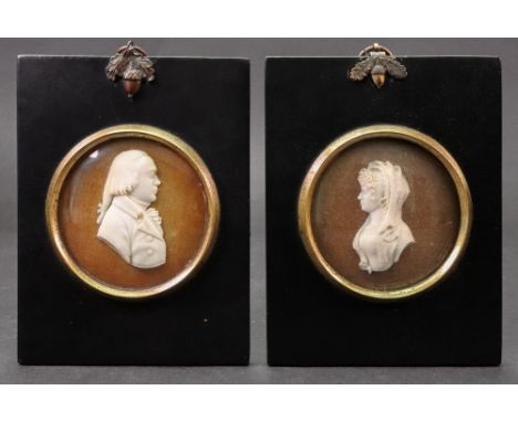 Two George III portrait busts, one depicting Julie St. John married July 9th 1787, profile facing to sinister, mounted in gla