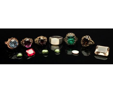 A collection of gem-set rings comprising: a blue spinel dress ring of abstract design, the circular-cut spinel claw-set to a 