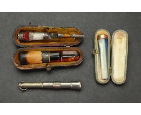 A 9ct gold mounted mother of pearl cigarette holder, 5.5cm long, in fitted case, a silver mounted cigar holder in fitted case