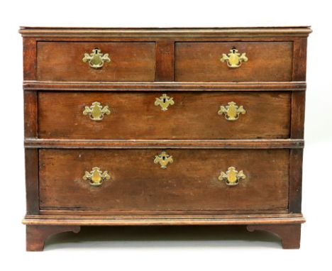 An oak chest, late 17th/early 18th century, altered, of panelled construction, the moulded edge rectangular top above two sho