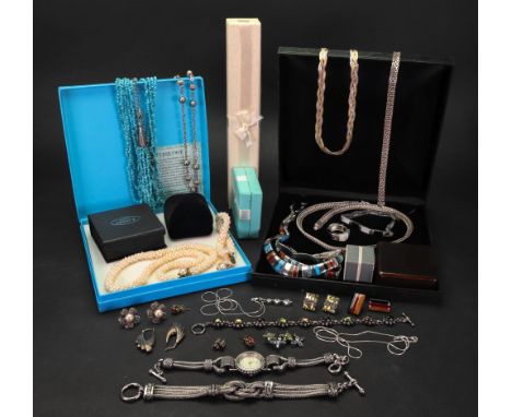 A collection of silver and paste costume jewellery, comprising: a multistrand turquoise bead necklace, suspended from a silve