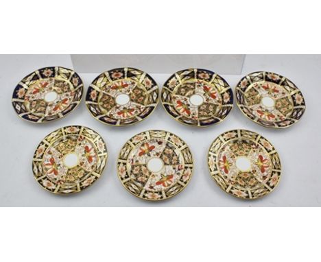 THREE ROYAL CROWN DERBY IMARI PATTERNED PORCELAIN SIDE PLATES, 13cm diameter, and four SAUCERS 