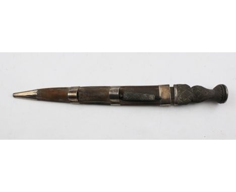 A LATE 19TH CENTURY SCOTTISH DIRK, having carved wood weave effect handle, white metal mounts, the leather scabbard stamped "