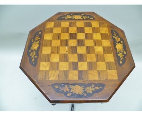 A VICTORIAN MARQUETRY INLAID TILT-TOP ROSEWOOD & SATINWOOD GAMES TABLE, having chequerboard inlaid octagonal top with four fl