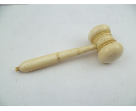 A LATE 19TH CENTURY IVORY GAVEL having ring turned head and knop tip to handle, 12.5cm long 