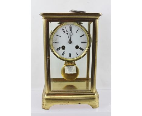 A 19TH CENTURY BRASS CASED FOUR GLASS MANTEL CLOCK with French Japy Freres movement, white enamel dial with Roman numerals an